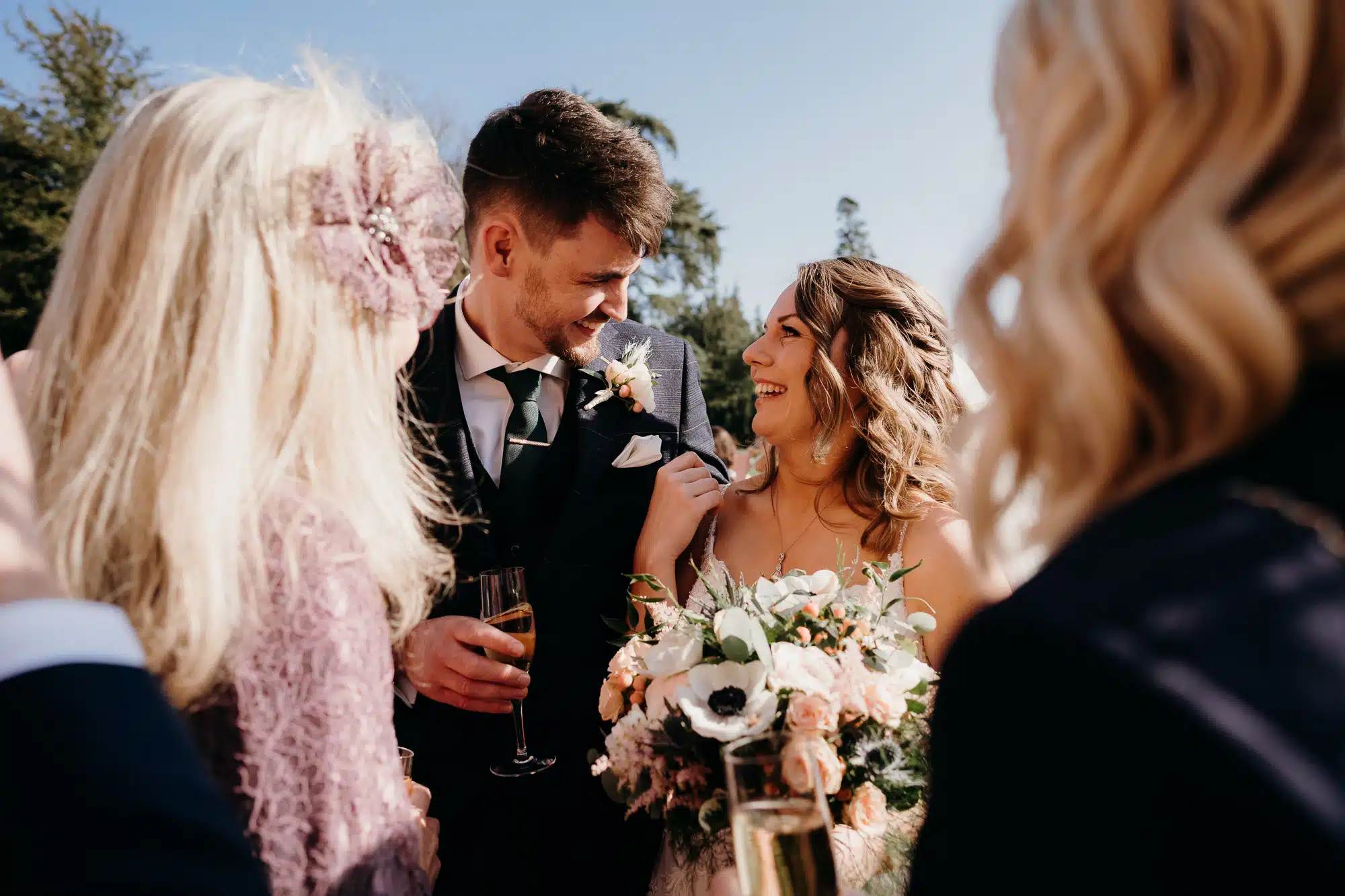 Bride & groom with blue skies background